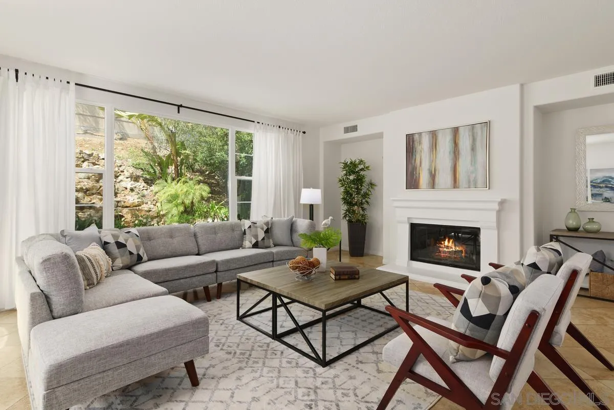 7542 Circulo Sequoia Carlsbad, CA 92009 - Photo 7 of 24 a living room with furniture and a fireplace