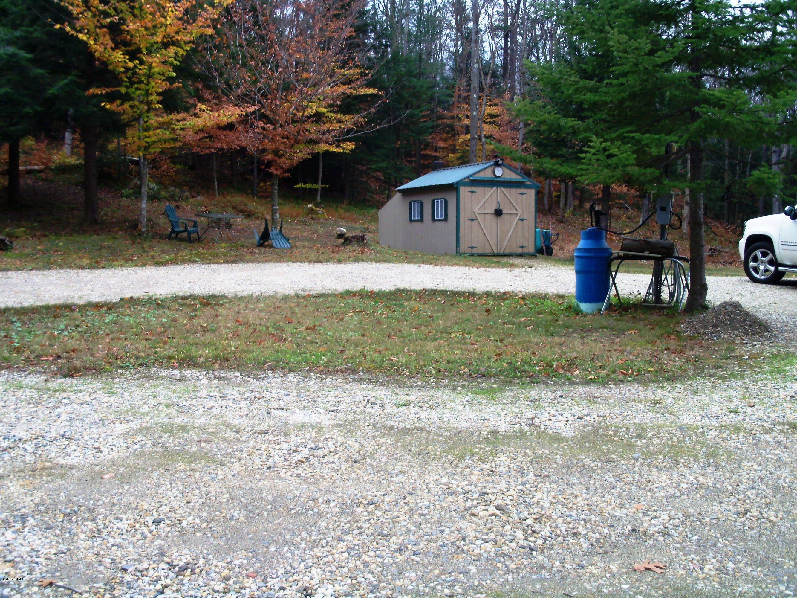 20 S Road Peru, MA 01235 - Photo 2 of 24 a front view of a house with a yard and a bike
