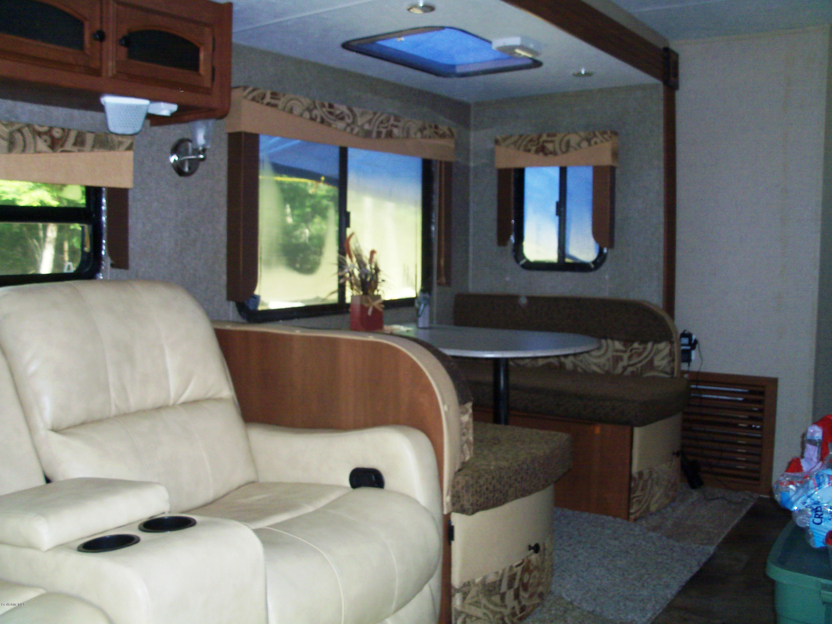 20 S Road Peru, MA 01235 - Photo 15 of 24 a living room with a couch and a flat screen tv