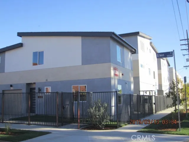 a front view of a building with street view