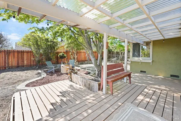 a view of a backyard with sitting area