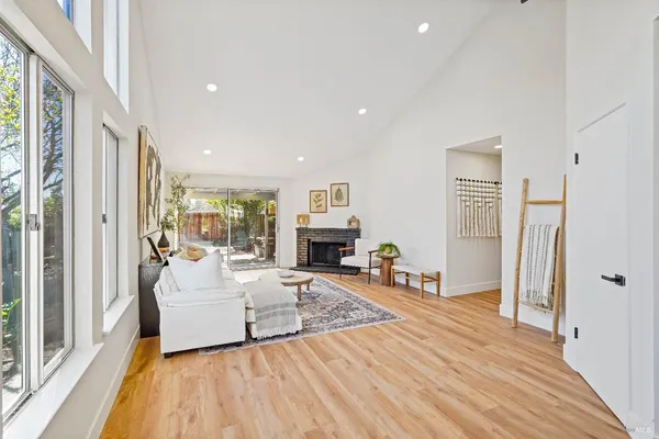 a living room with furniture and a fireplace
