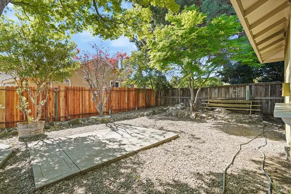 a backyard of a house with bicycles parked