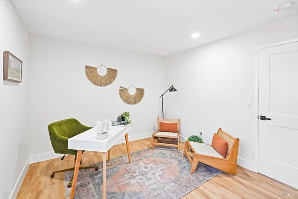 a living room with furniture and a chair