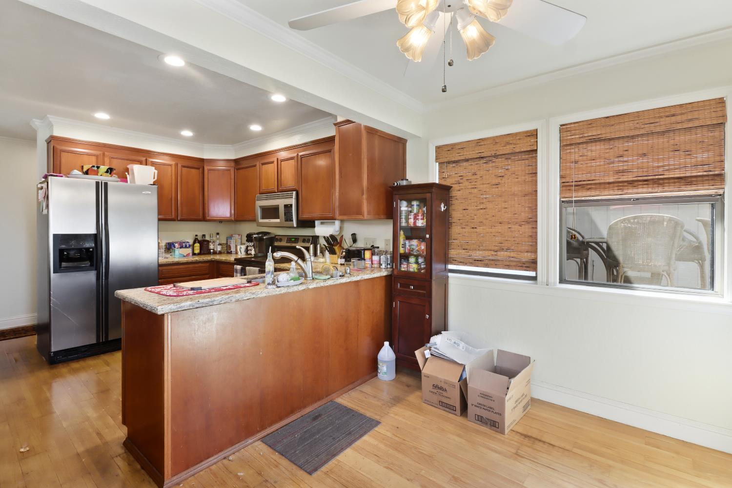 1635 Country Club Drive Placerville, CA 95667 - Photo 14 of 58 a kitchen with stainless steel appliances granite countertop a refrigerator a sink a stove and a wooden floors