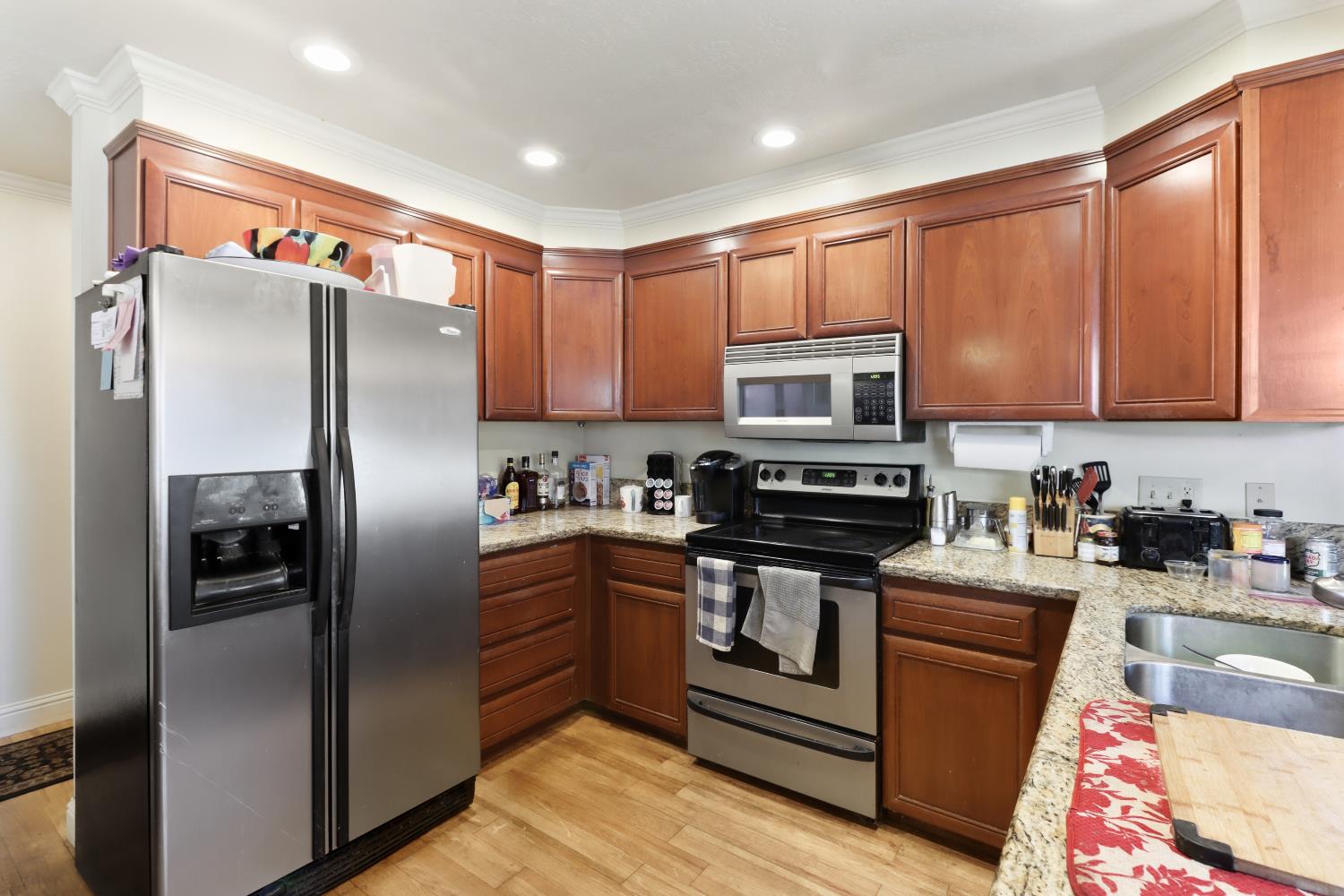 1635 Country Club Drive Placerville, CA 95667 - Photo 16 of 58 a kitchen with stainless steel appliances granite countertop a refrigerator stove and microwave
