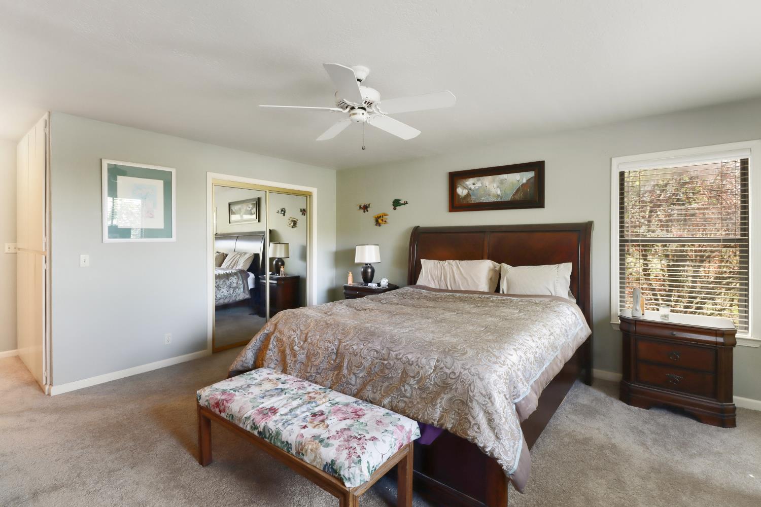 1635 Country Club Drive Placerville, CA 95667 - Photo 25 of 58 a bedroom with a bed and a dresser with rug