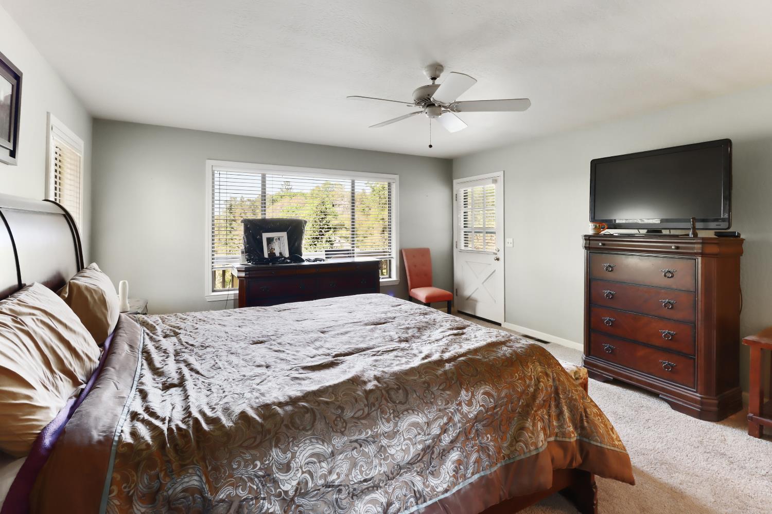 1635 Country Club Drive Placerville, CA 95667 - Photo 26 of 58 a bedroom with a bed and a flat screen tv