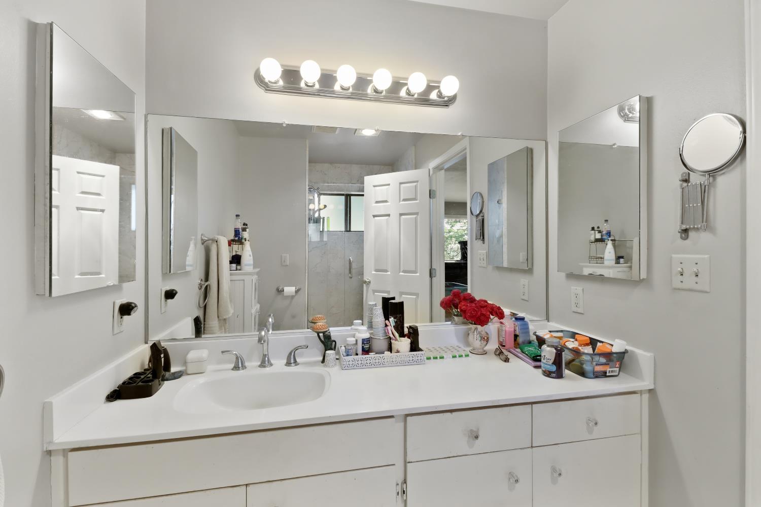 1635 Country Club Drive Placerville, CA 95667 - Photo 27 of 58 a bathroom with a sink double vanity and a mirror