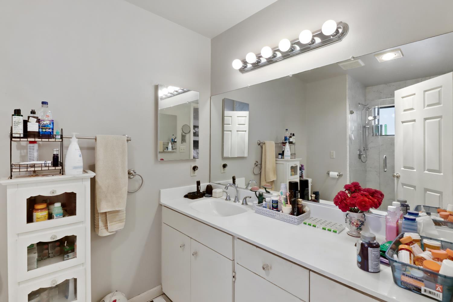 1635 Country Club Drive Placerville, CA 95667 - Photo 28 of 58 a bathroom with a sink vanity tub and shower