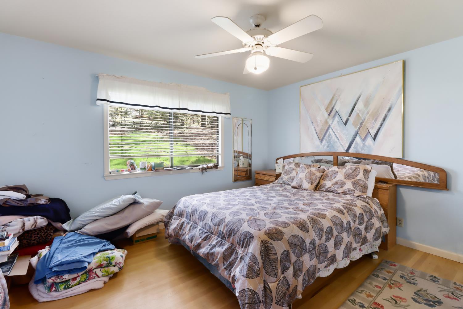 1635 Country Club Drive Placerville, CA 95667 - Photo 30 of 58 a bed sitting in a bedroom next to a window