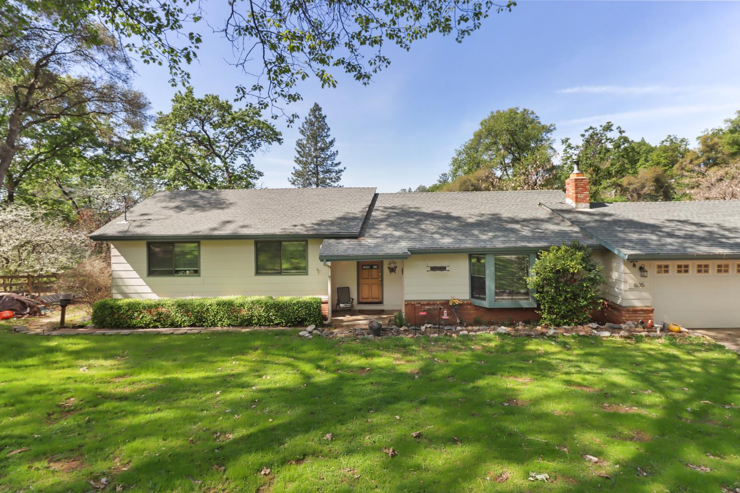 1635 Country Club Drive Placerville, CA 95667 - Photo 3 of 58 a front view of a house with garden