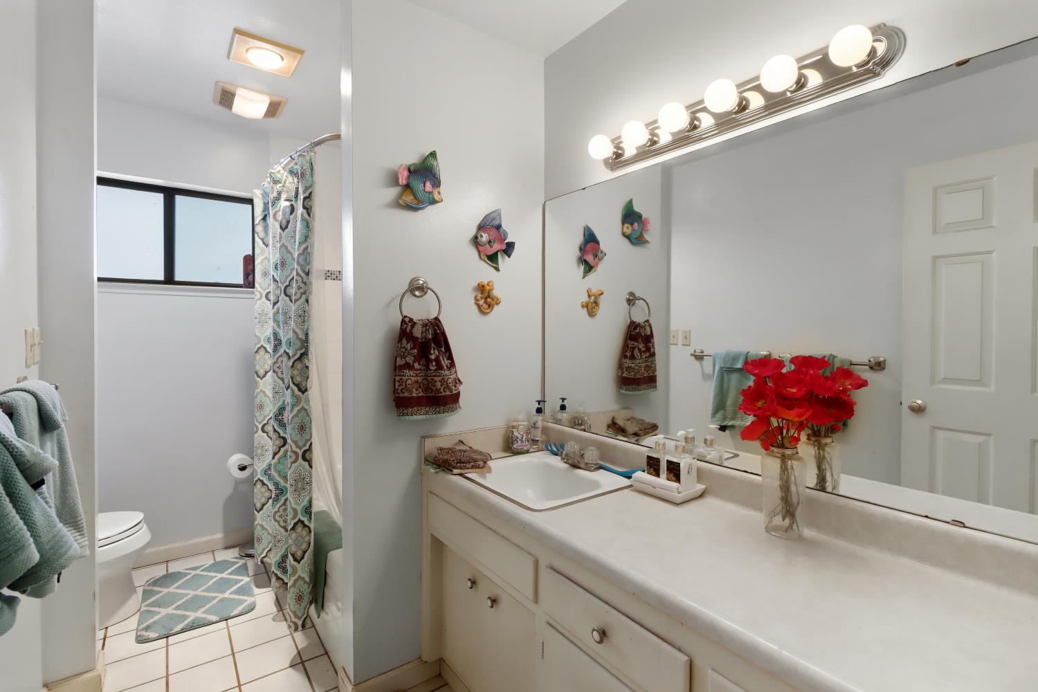1635 Country Club Drive Placerville, CA 95667 - Photo 31 of 58 a bathroom with a sink a large mirror and a shower