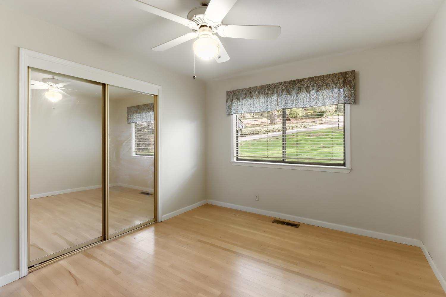 1635 Country Club Drive Placerville, CA 95667 - Photo 32 of 58 an empty room with fan and windows