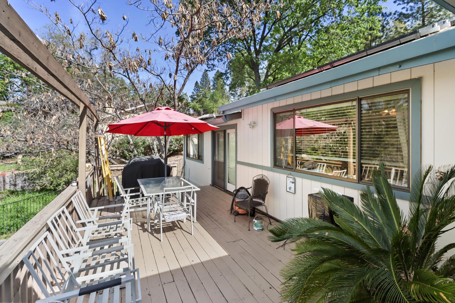1635 Country Club Drive Placerville, CA 95667 - Photo 35 of 58 a view of a patio with a table chairs and a wooden deck