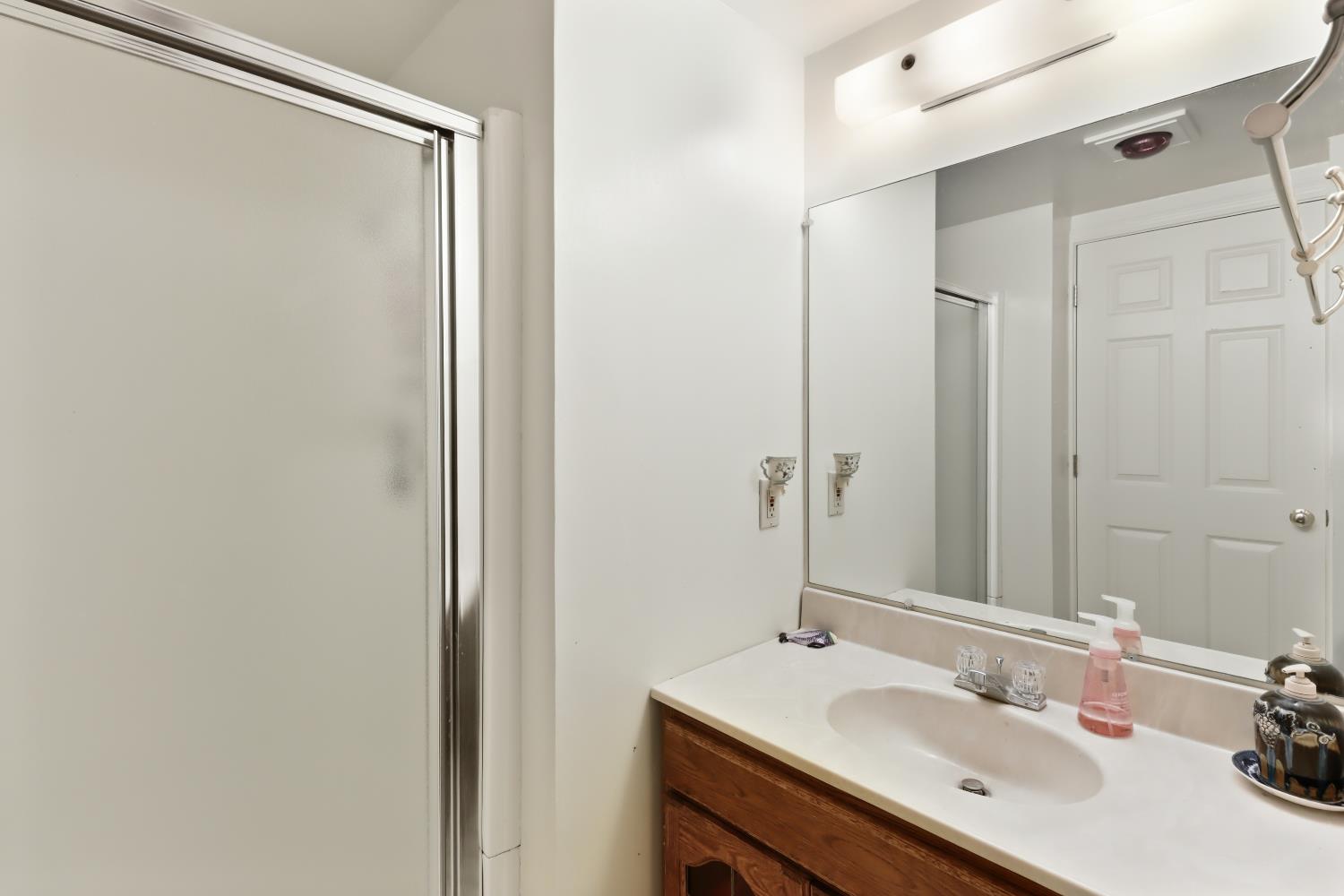 1635 Country Club Drive Placerville, CA 95667 - Photo 56 of 58 a bathroom with a sink and a mirror