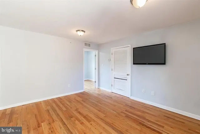 a view of a livingroom with wooden floor