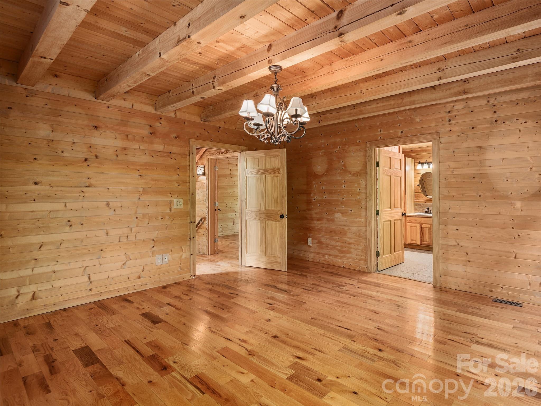 413 Green Hills Road Mill Spring, NC 28756 - Photo 18 of 48 a view of empty room with wooden floor