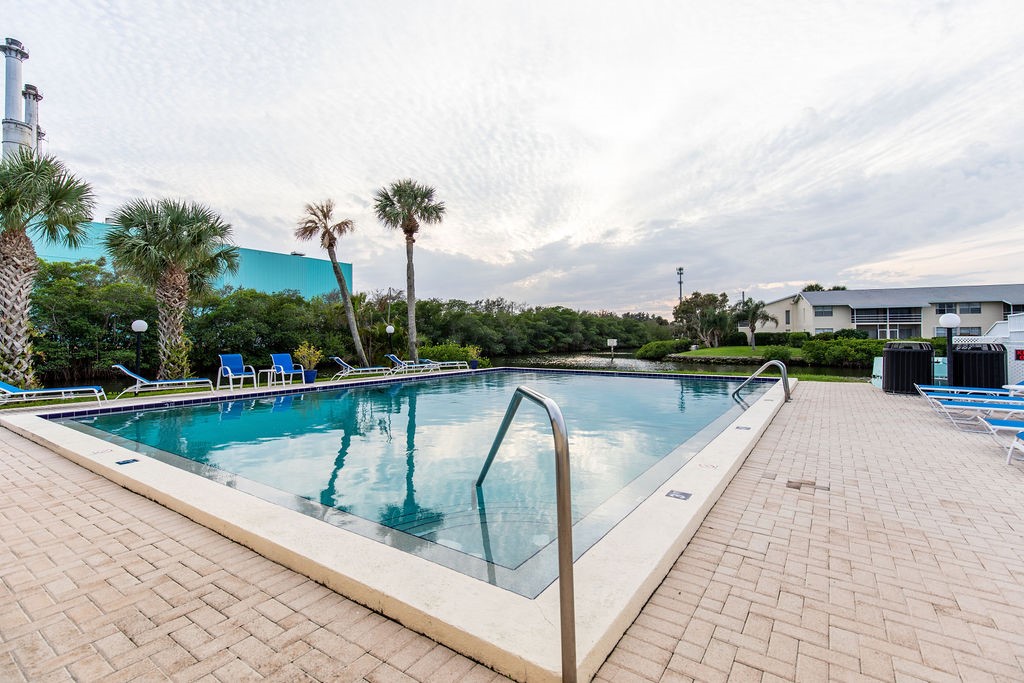 1815 Robalo Drive, Unit C201 Vero Beach, FL 32960 - Photo 29 of 31 a view of swimming pool with a lake view