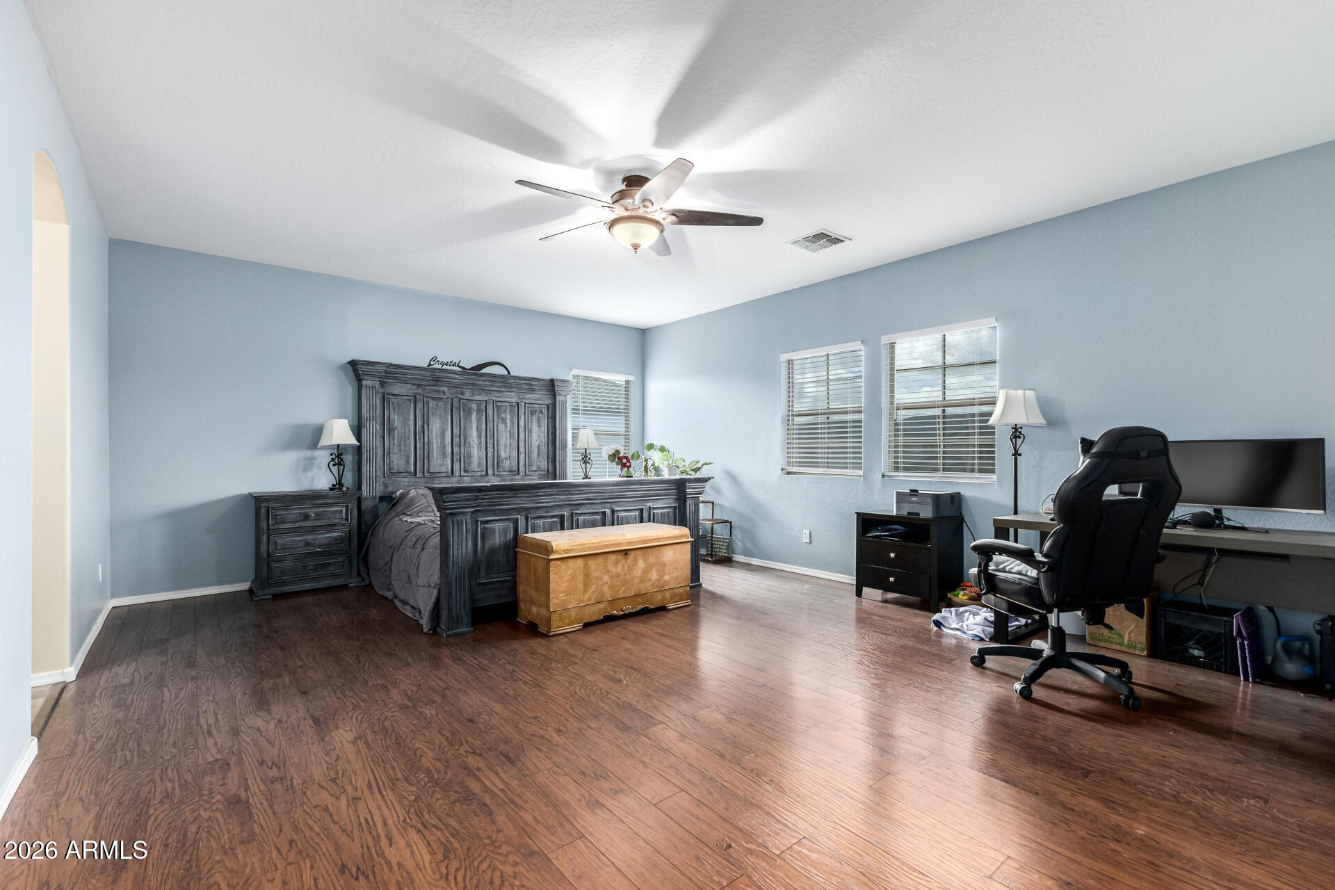 24541 Plum Road Florence, AZ 85132 - Photo 17 of 47 a bedroom with furniture window and a ceiling fan