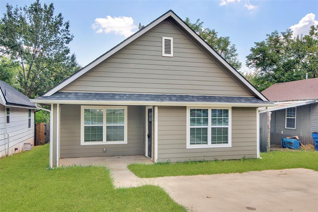 622 East Heron Street Denison, TX 75021 - Photo 1 of 20 View of front of house featuring a front yard and roof with shingles
