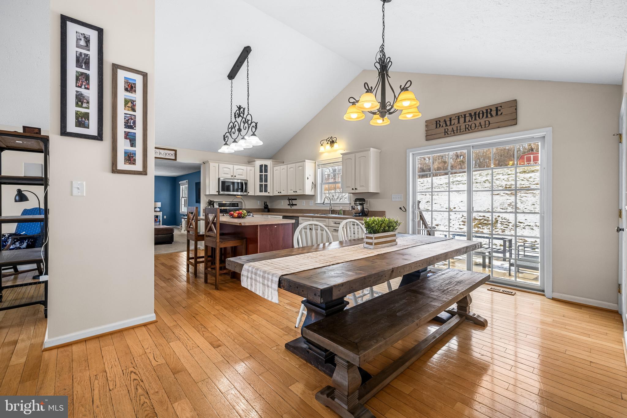 12270 High Point Road Felton, PA 17322 - Photo 8 of 45 a living room with kitchen island furniture and a chandelier