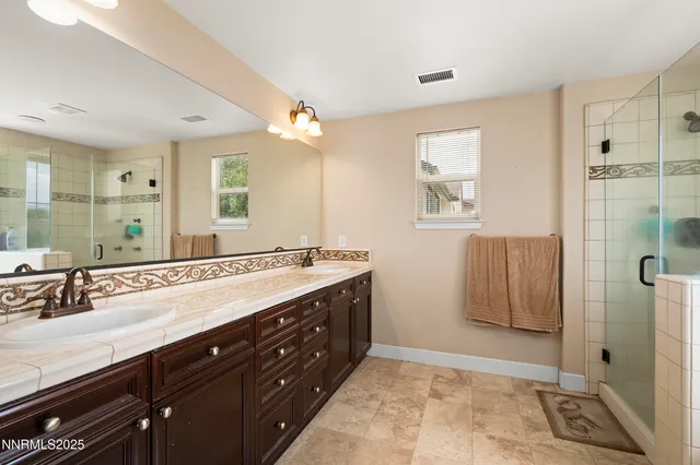 a bathroom with a bathtub and shower