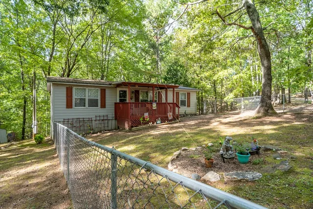 a view of a house with backyard