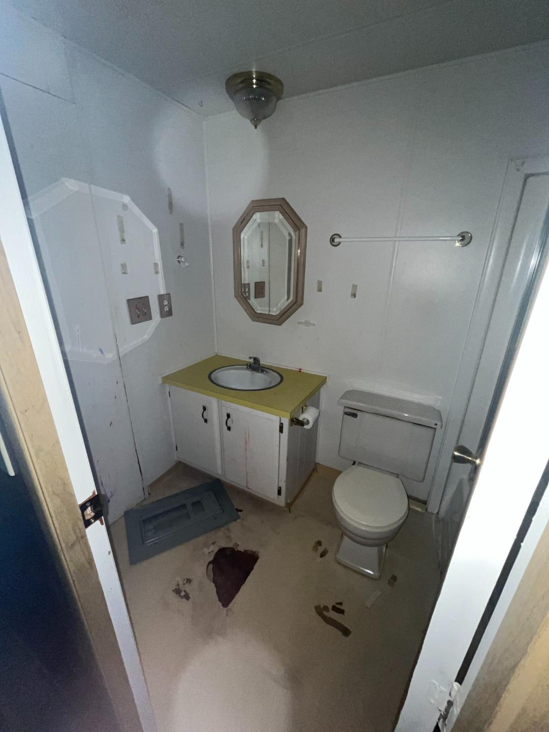 Undisclosed Address Central Point, OR 97502 - Photo 12 of 16 a bathroom with a sink mirror vanity and toilet