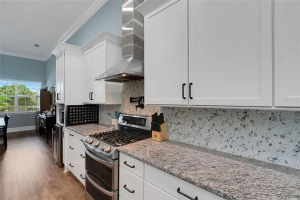 a kitchen with a stove and a sink