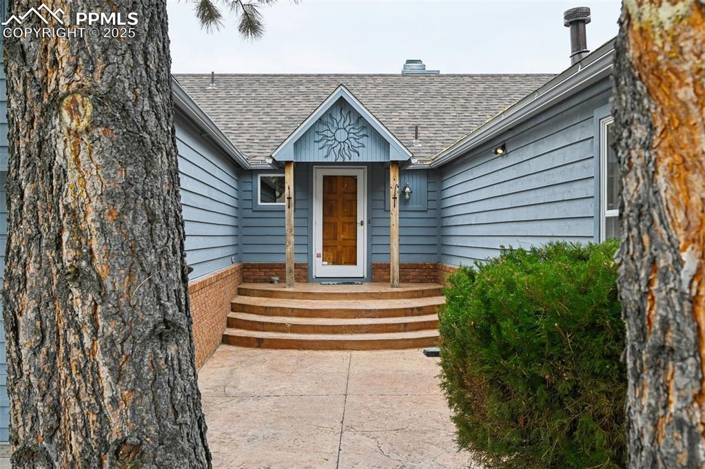 17580 Chipped Arrow Way Monument, CO 80132 - Photo 1 of 50 a view of a house with more windows and plants