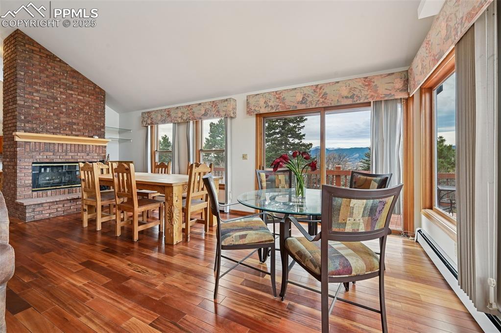 17580 Chipped Arrow Way Monument, CO 80132 - Photo 17 of 50 a dining room with furniture window and wooden floor