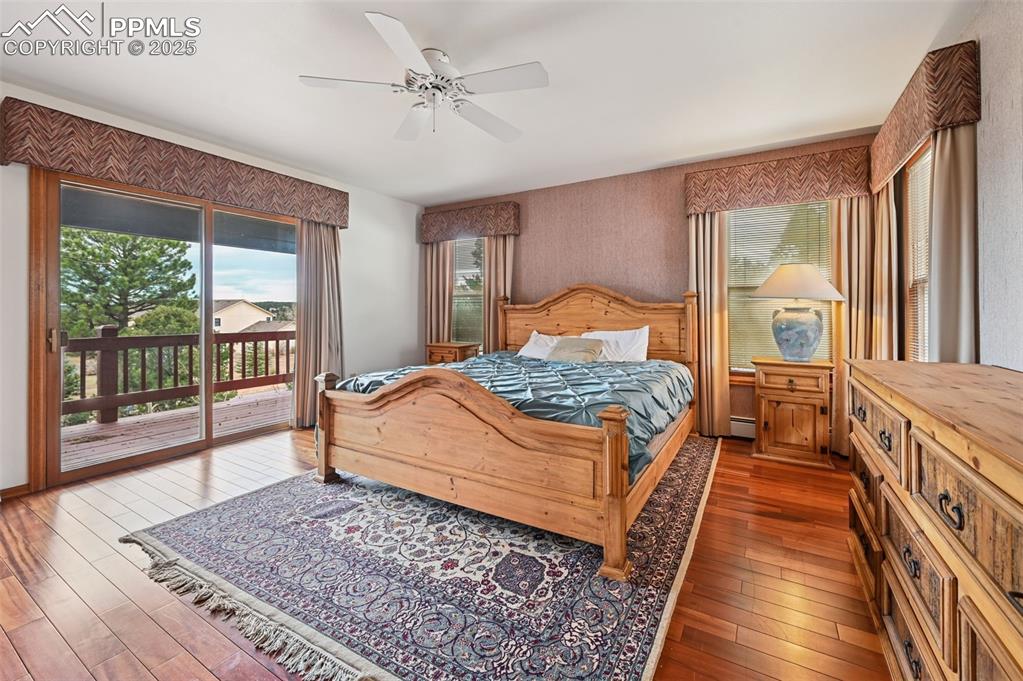 17580 Chipped Arrow Way Monument, CO 80132 - Photo 30 of 50 a bedroom with a large bed and a window