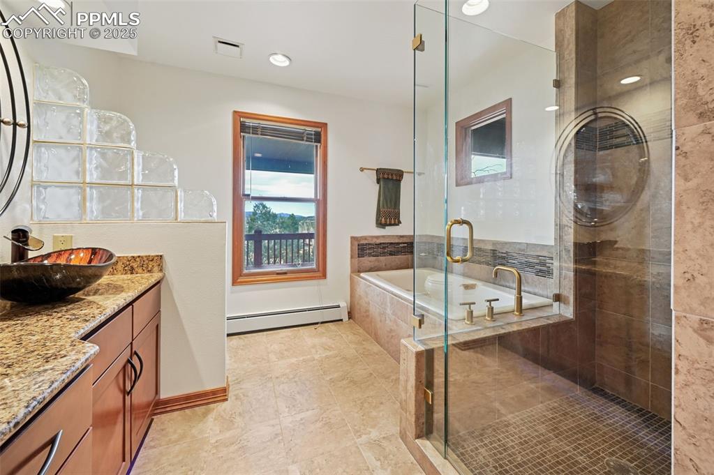 17580 Chipped Arrow Way Monument, CO 80132 - Photo 34 of 50 a kitchen with stainless steel appliances granite countertop a sink a stove and a refrigerator