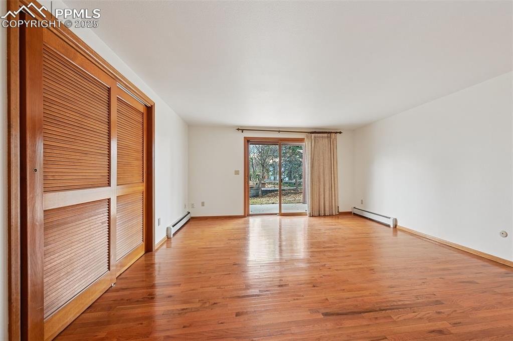 17580 Chipped Arrow Way Monument, CO 80132 - Photo 39 of 50 a view of an empty room with wooden floor and a window