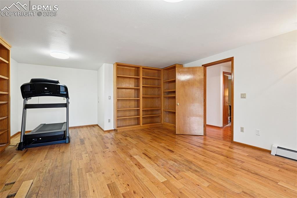 17580 Chipped Arrow Way Monument, CO 80132 - Photo 47 of 50 an empty room with wooden floor and closet