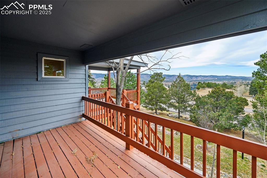 17580 Chipped Arrow Way Monument, CO 80132 - Photo 7 of 50 a view of a balcony with wooden floor