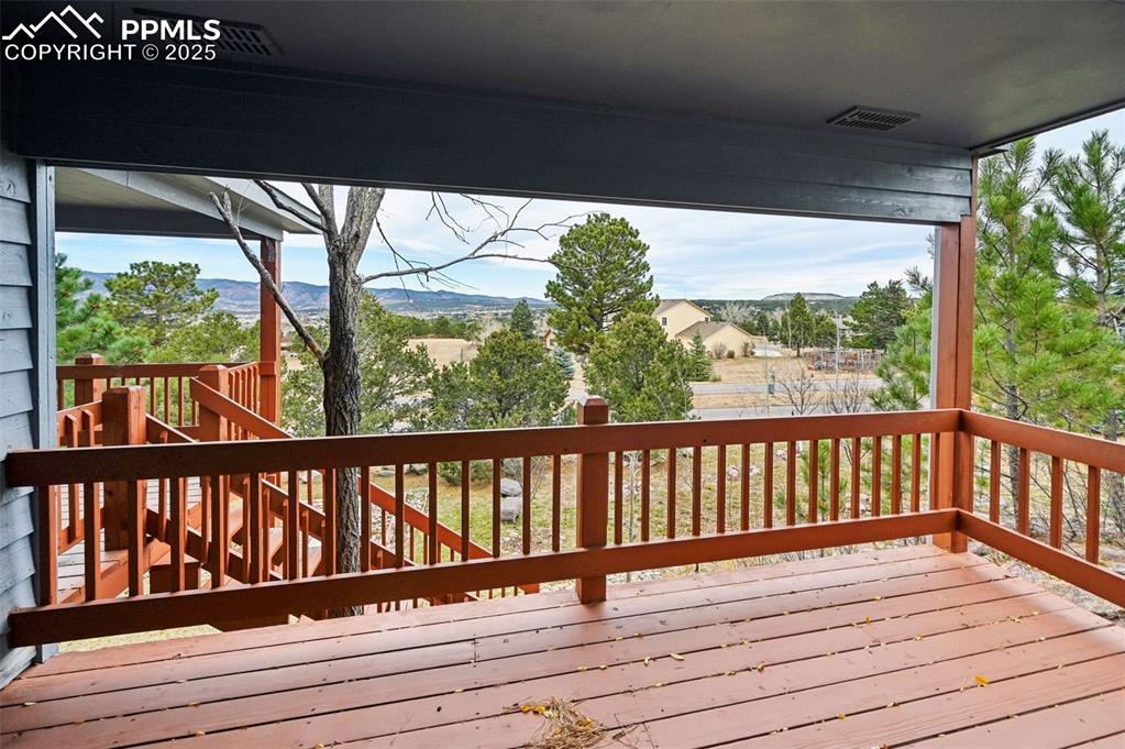17580 Chipped Arrow Way Monument, CO 80132 - Photo 8 of 50 a view of balcony with wooden floor