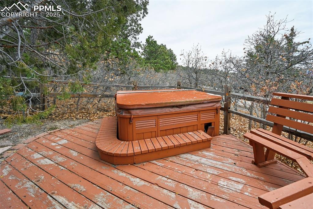 17580 Chipped Arrow Way Monument, CO 80132 - Photo 9 of 50 a view of a wooden deck with a bench