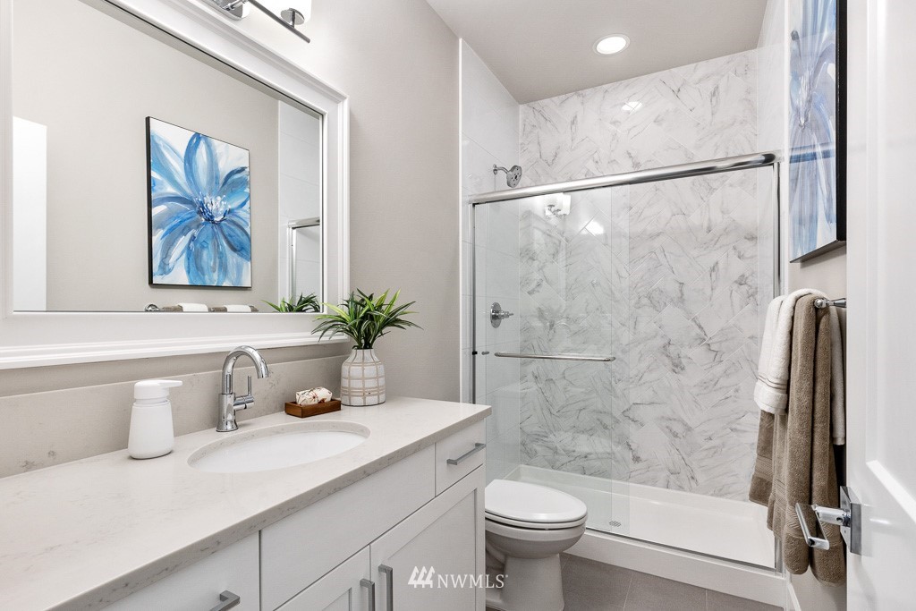 19037 85th ( 4) Avenue Bothell, WA 98011 - Photo 12 of 30 a bathroom with a sink a toilet and a bathtub