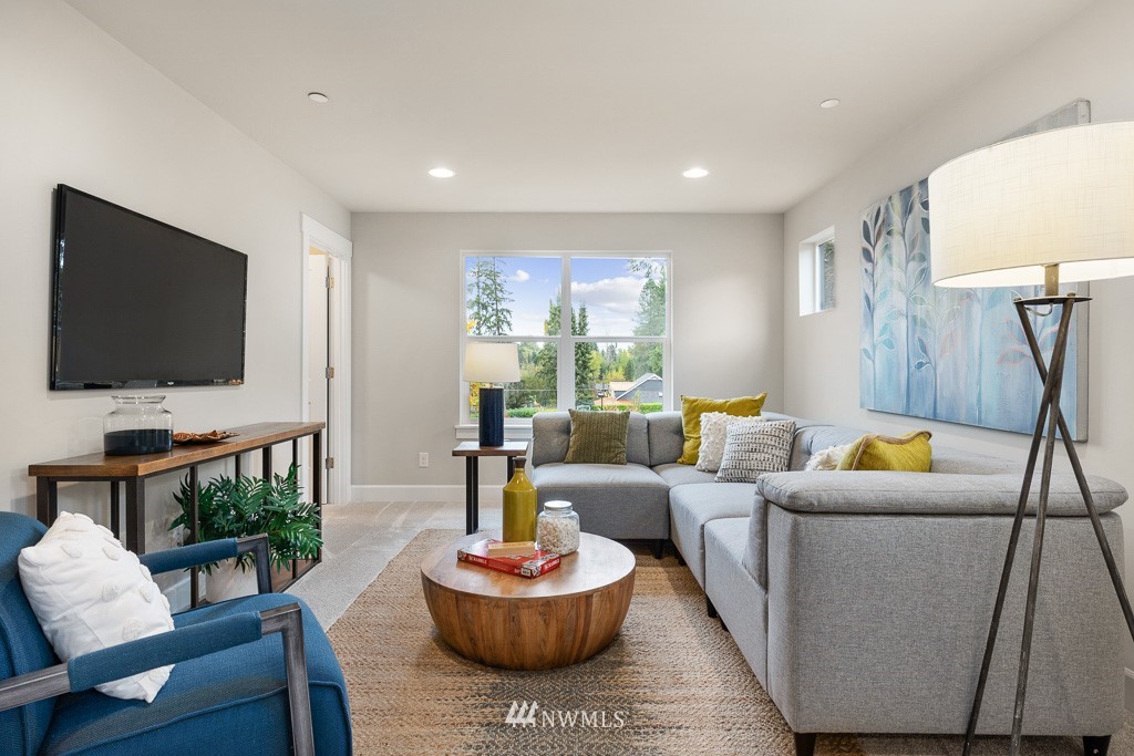 19037 85th ( 4) Avenue Bothell, WA 98011 - Photo 13 of 30 a living room with furniture and a flat screen tv