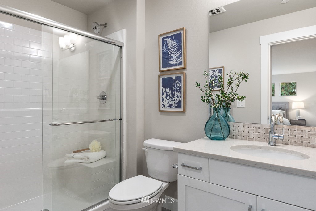 19037 85th ( 4) Avenue Bothell, WA 98011 - Photo 21 of 30 a bathroom with a sink a toilet and shower