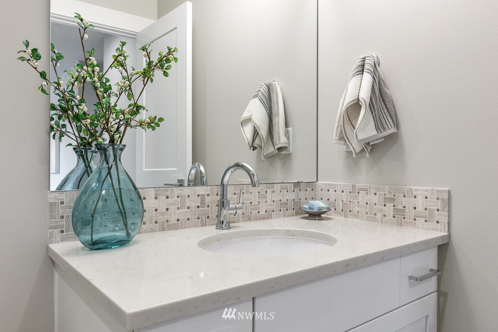 19037 85th ( 4) Avenue Bothell, WA 98011 - Photo 23 of 30 a bathroom with a sink and a mirror