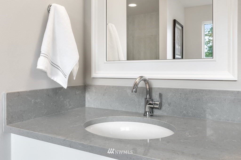 19037 85th ( 4) Avenue Bothell, WA 98011 - Photo 28 of 30 a bathroom with a sink and a mirror