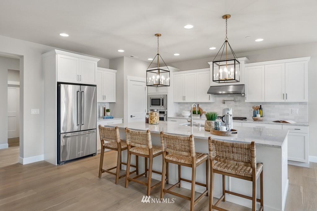 19037 85th ( 4) Avenue Bothell, WA 98011 - Photo 5 of 30 a kitchen with refrigerator a sink and chairs