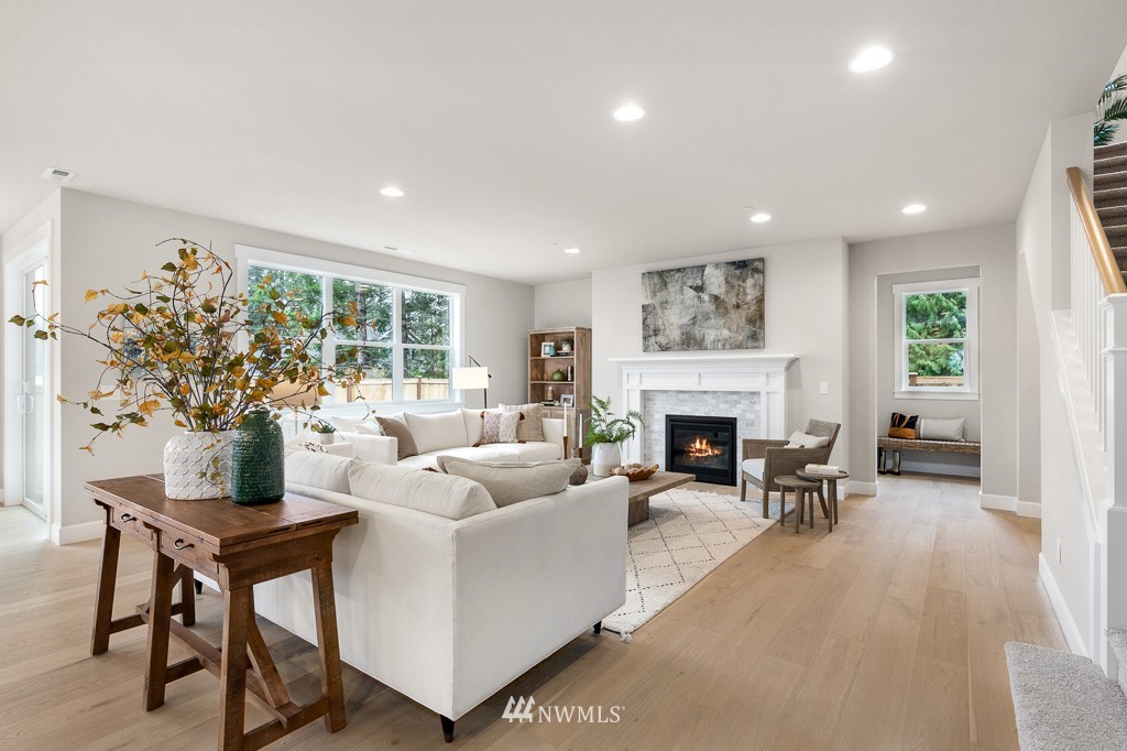 19037 85th ( 4) Avenue Bothell, WA 98011 - Photo 9 of 30 a living room with furniture a fireplace and a potted plant