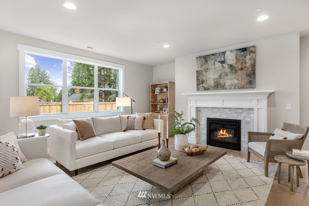 19037 85th ( 4) Avenue Bothell, WA 98011 - Photo 10 of 30 a living room with furniture and a fireplace