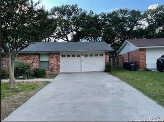 a house view with a garden space