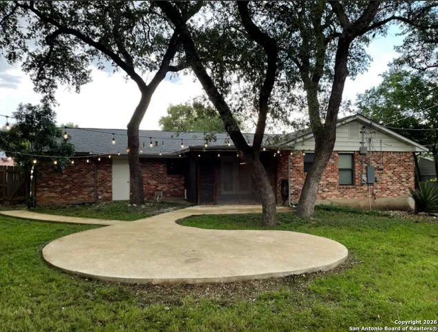 a backyard of a house with yard and entertaining space