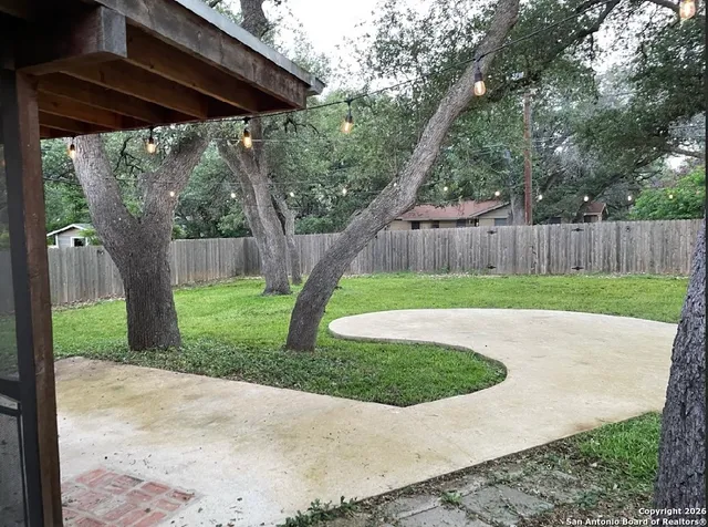 a view of backyard with green space